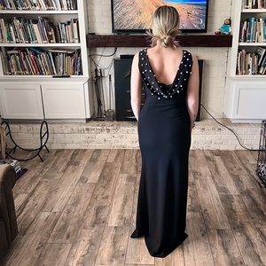 Gorgeous black gown with pearl back detail.